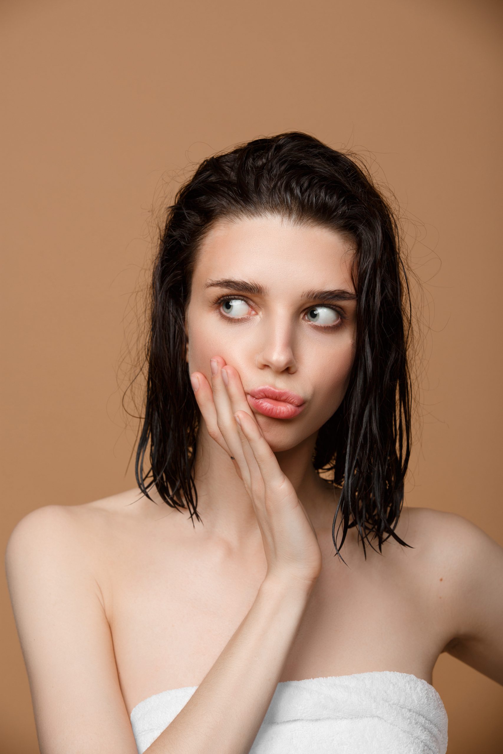 Woman cleaning her face